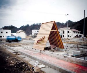 Kamaishi, December 6 2011 - Gassho by KOJI KAKIUCHI and YAOMITSU DESIGNING DEPARTMENT, a wooden structure for people to gather, built on the ruins of a house devastated by the tsunami.
