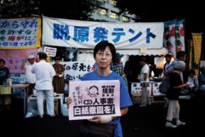 Tokyo, August 31st 2012 - Portrait of Mie Anthearn in front of the anti-nuke tents in Kasumigaseki.