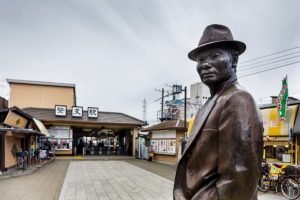 Tokyo, March 10 2015 - Shibamata, in the footsteps of Tora-san and Yoji Yamada. Statue of Tora-san at the exit of the station.
