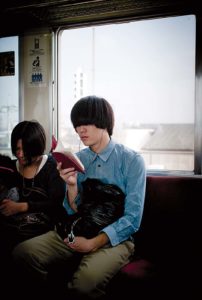 Tokyo, October 15 2010 - Reading on the train.