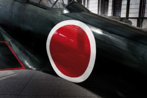 Tokyo, April 10 2014 - In the entrance of the Yushukan, Yasukuni's war museum, a A6M Zero fighter aircraft on display.