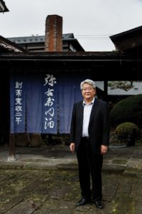 Kitakata, Fukushima prefecture, November 19 2013 - Mr SATO, president of Yauemon distillery posing in front of the museum.