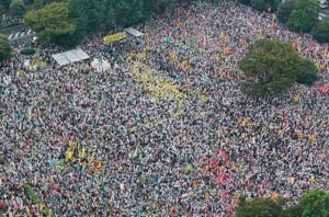 An aerial view from Kyodo shows people attending an anti-nuclear rally at Meiji Park in Tokyo September 19, 2011. Some 60,000 protesters from across Japan including a Nobel-prize-winning author Kenzaburo Oe, gathered in central Tokyo for an anti-nuclear rally on Monday, urging the Japanese government to cut reliance on atomic power. Mandatory Credit REUTERS/Kyodo (JAPAN - Tags: DISASTER ENERGY) FOR EDITORIAL USE ONLY. NOT FOR SALE FOR MARKETING OR ADVERTISING CAMPAIGNS. THIS IMAGE HAS BEEN SUPPLIED BY A THIRD PARTY. IT IS DISTRIBUTED, EXACTLY AS RECEIVED BY REUTERS, AS A SERVICE TO CLIENTS. MANDATORY CREDIT. JAPAN OUT. NO COMMERCIAL OR EDITORIAL SALES IN JAPAN. YES